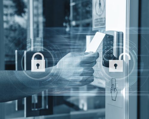 hand,using,security,key,card,unlocking,the,door,to,entering